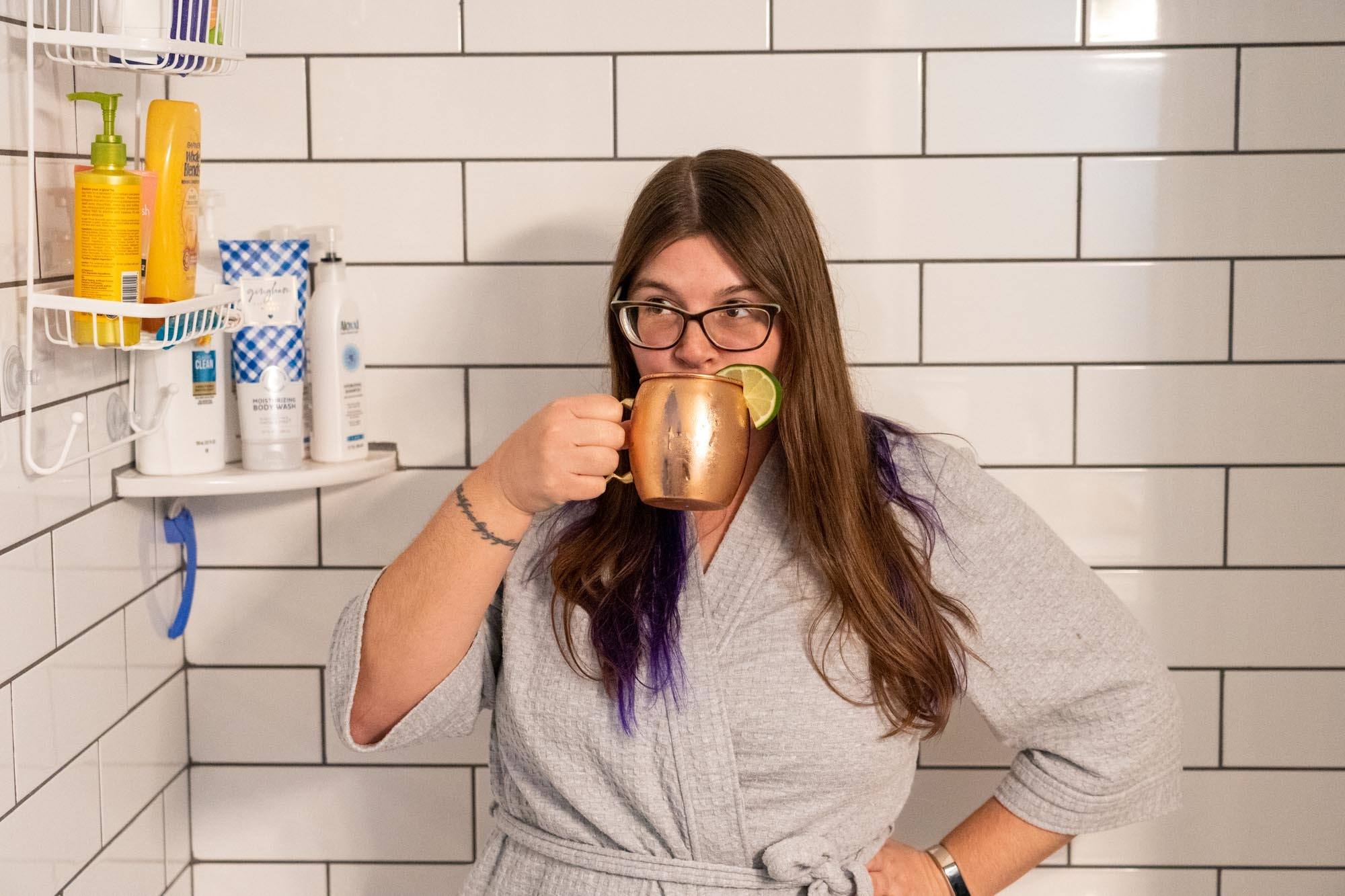 Amanda drinking in the shower